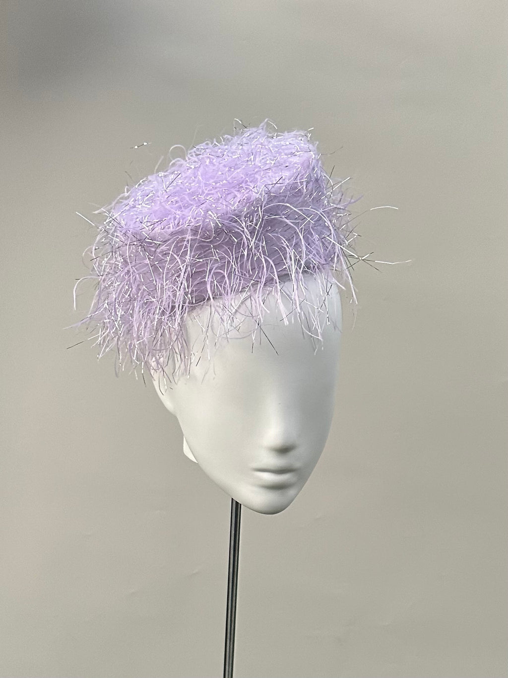 Frange di Luce soft lilac pillbox hat with a feathered texture and silver Lurex highlights