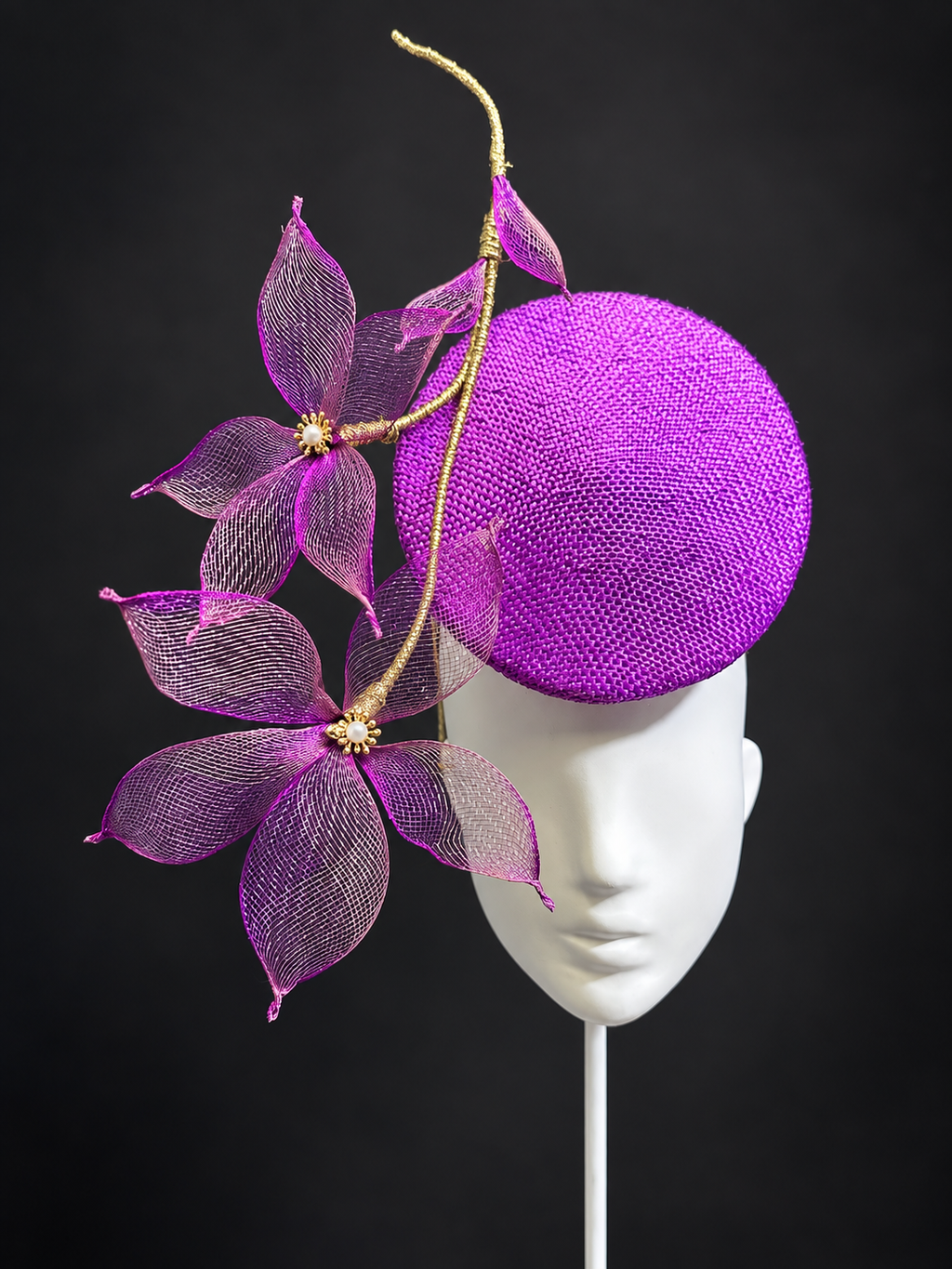 Le Jardin d’Avril magenta percher fascinator with sculptural mesh flowers and golden stems