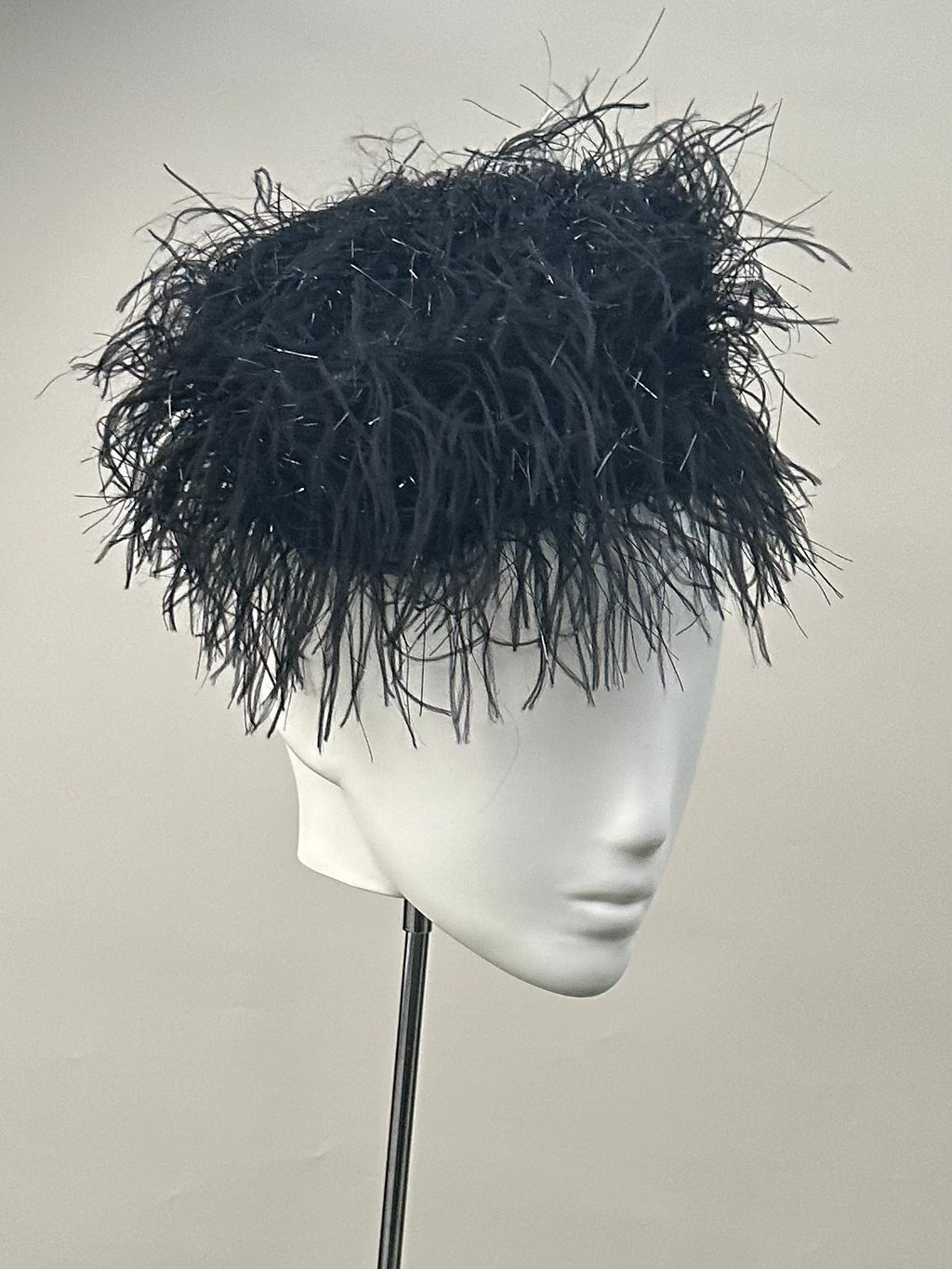 Frange di Luce black textured pillbox hat with an angled silhouette and Lurex shimmer