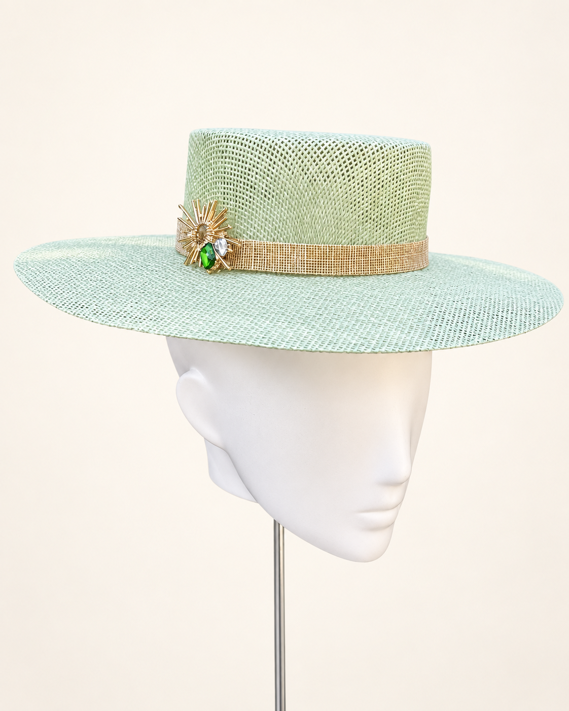 L’Orbite de Val mint wide-brim hat with gold band and sunburst jewel