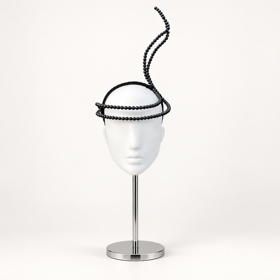 Black sculptural halo headpiece with pearl-like beads
