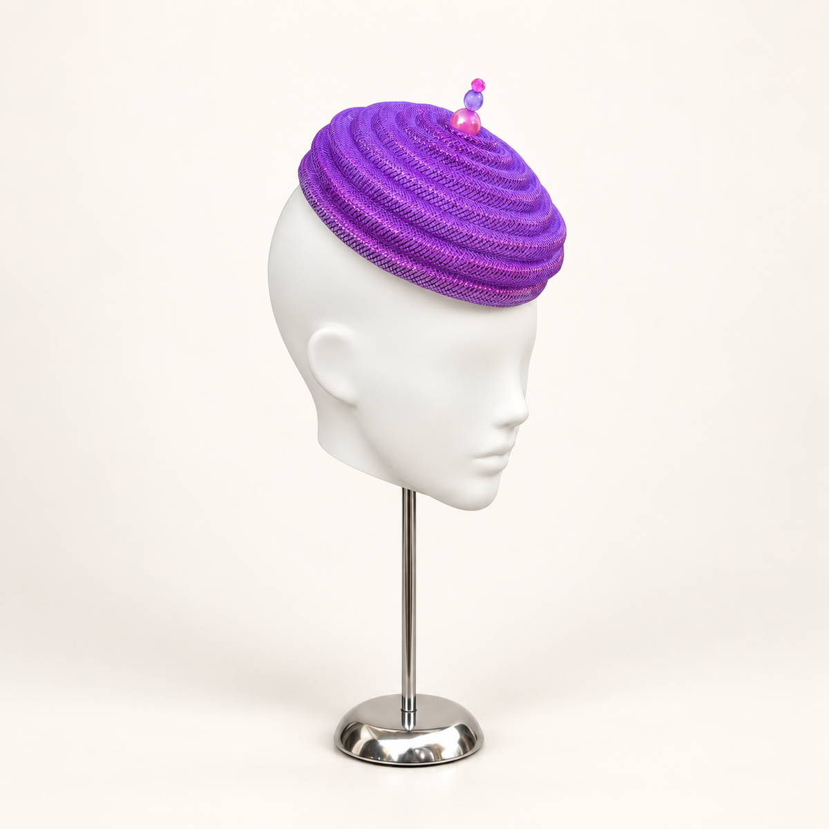 Onda Azzurra magenta-purple sculptural spiral pillbox — angle view