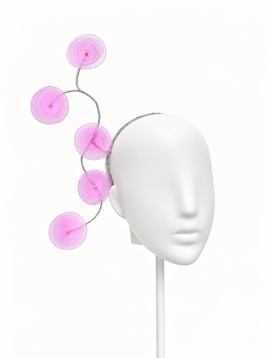 Ricordo di Positano pink organza floral headband on a white mannequin