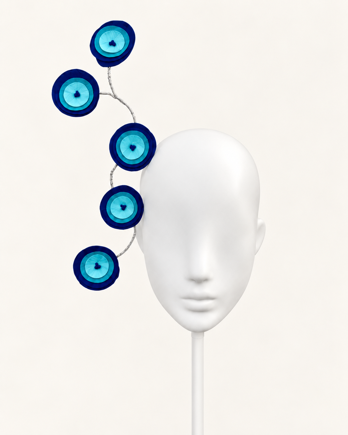 Mati Ionico — Greek Eye Sculptural Headband — white mannequin and white stand, view 1