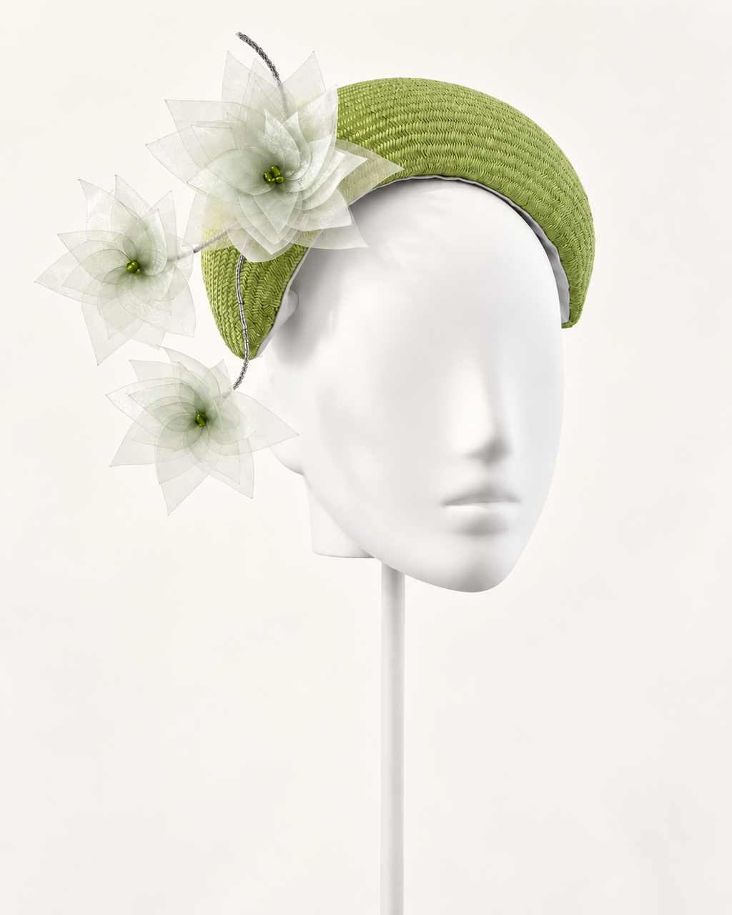 Verde in Fiore — Sculptural Floral Crescent on a white mannequin and stand, view 1