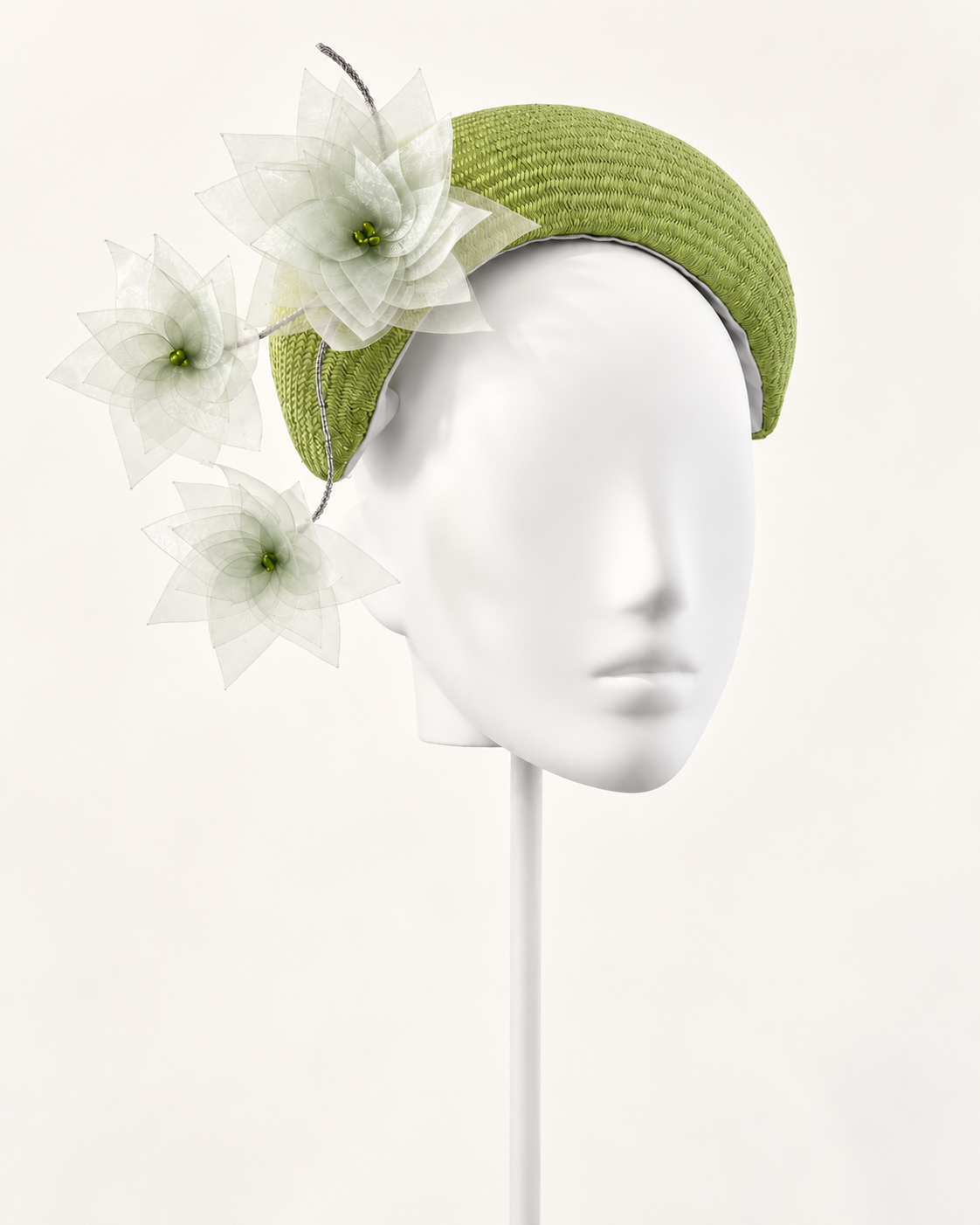 Verde in Fiore — Sculptural Floral Crescent on a white mannequin and stand, view 1