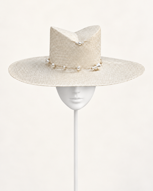 Bianco di Navagio — Pearl Wide-Brim Hat on a white mannequin and stand, view 1