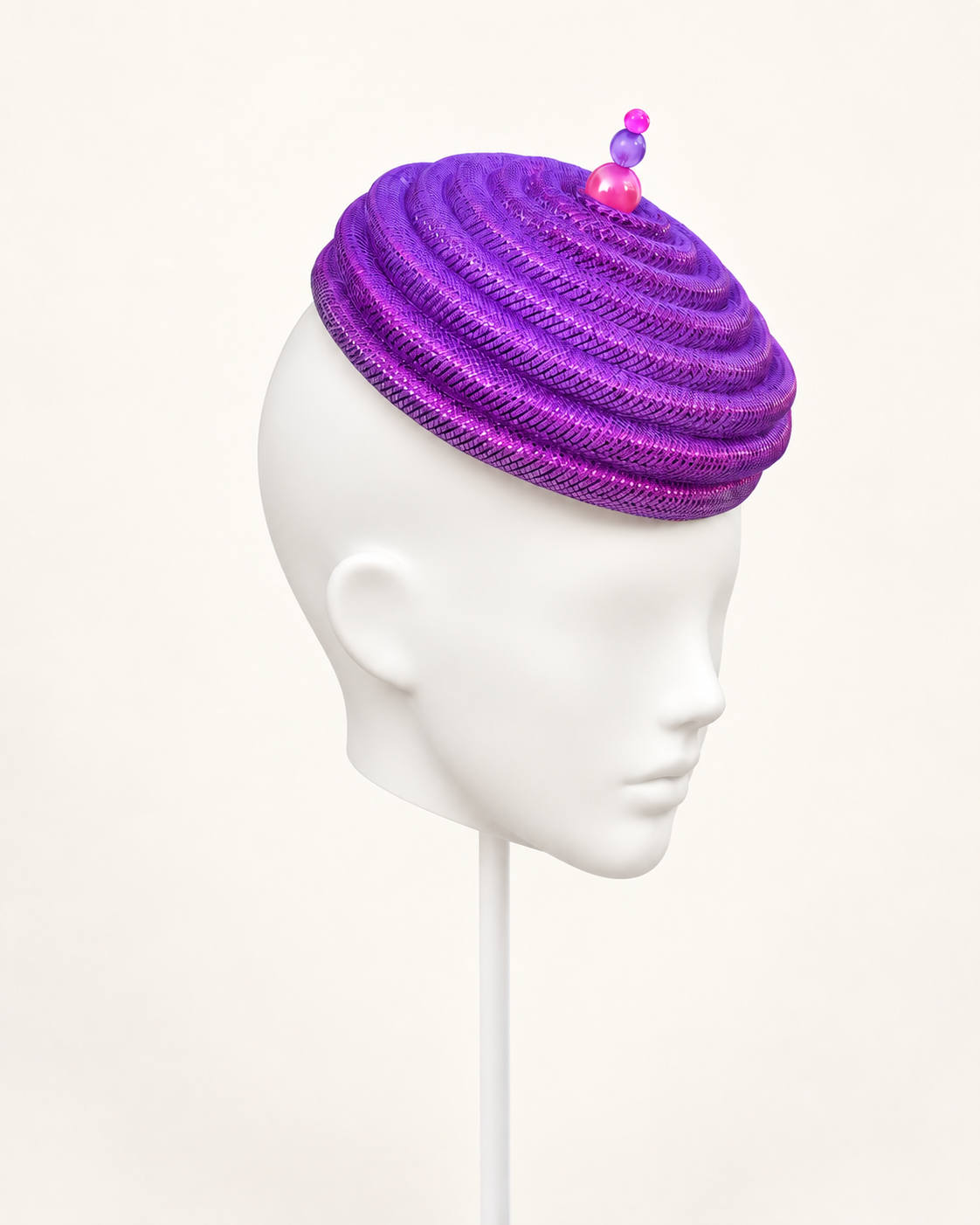 Onda Azzurra magenta-purple sculptural spiral pillbox — angle view