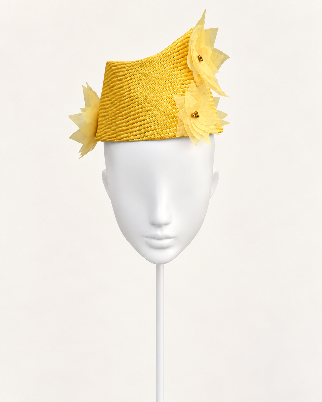 Verso Villasimius — Golden Floral Pillbox on a white mannequin and stand, view 1