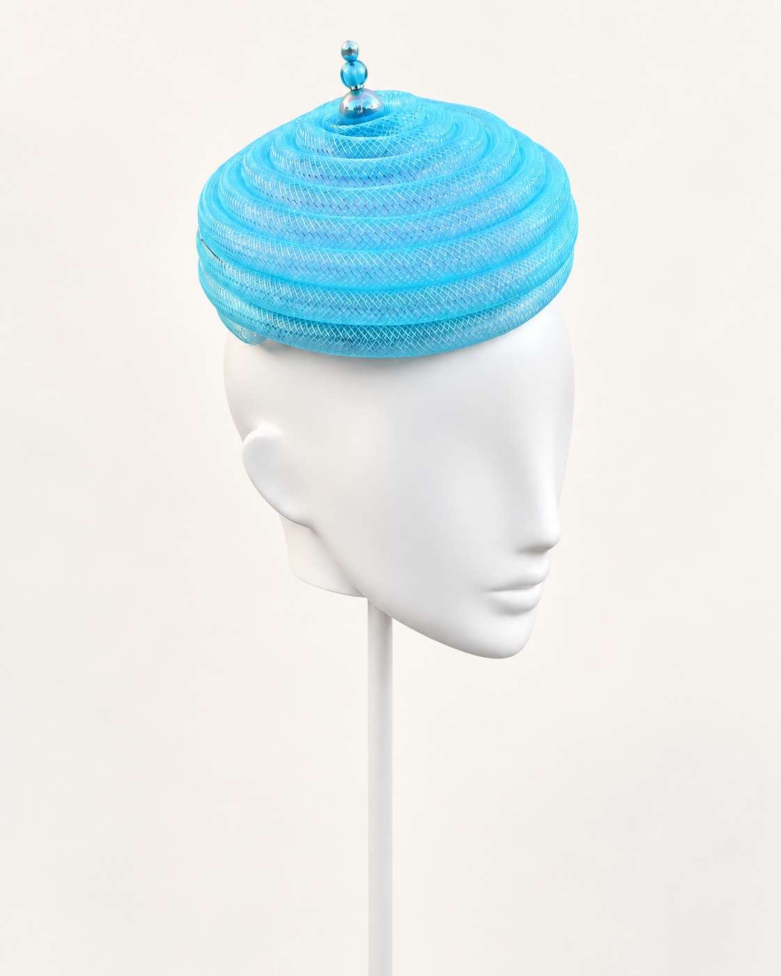 Onda Azzurra — Aqua Sculptural Spiral Pillbox on a white mannequin and stand, view 2